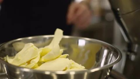 Work of a confectioner. Baking macarons. Dough butter close-up. Baking cookies a Stock-Footage 233294951