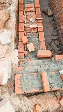 Work on the construction of a brick building. Stock Photos