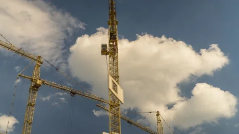 The work of construction cranes on the background of flying clouds, time laps Stock Footage 108817355