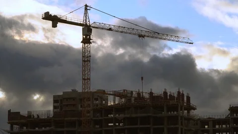 The work of construction cranes on the background of flying clouds Stock Footage 125581869