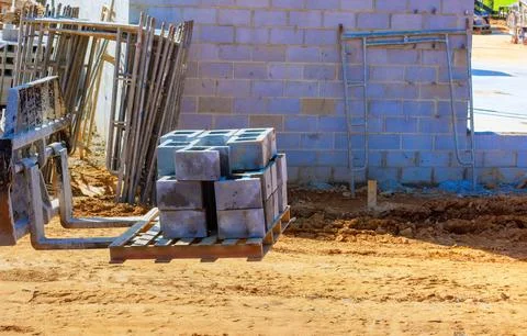 Work on a construction site involves use of construction equipment Foto stock