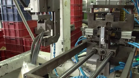 Work of the conveyor for the production of paint brushes close-up 4k. Stock Footage 77822429