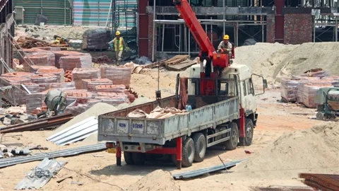 Work with a crane on a construction site Stock Footage 313326398