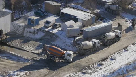 Work of cranes and cement trucks in an old factory in winter in Bishkek Stock Footage 226315058