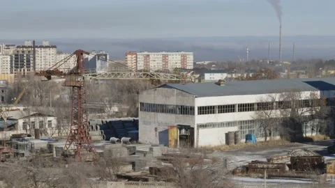Work of cranes and cement trucks in an old factory in winter in Bishkek Stock Footage 226319041