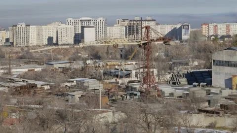 Work of cranes and cement trucks in an old factory in winter in Bishkek Stock Footage 226319186