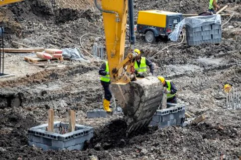 Work crews performs soil excavation work Stock Photos