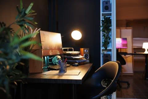 Work desk computer in neon lit home 写真素材