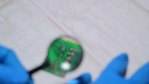 Work desk of an electronics engineer. Repair of equipment. The specialist conduc Stock Footage 84068942