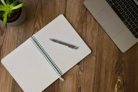 Work desk with laptop and notepad for notes Stock Photos