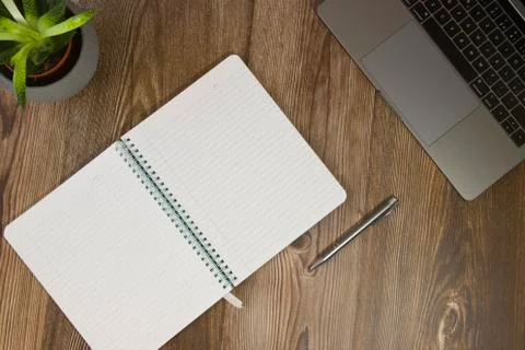 Work desk with laptop and notepad for notes Stock Photos