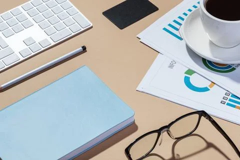 Work desk with papers, notepad, phone and coffee Stock Photos