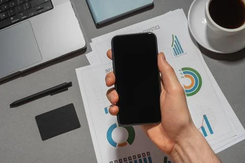 Work desk with papers, notepad, phone and coffee Stock Photos