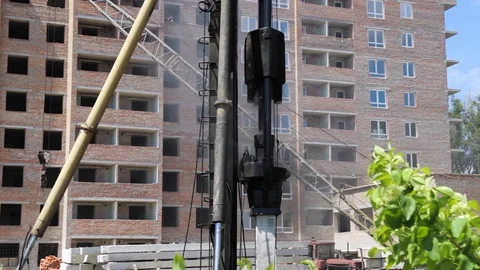 Work Diesel hammer machine for installing concrete piles for the foundation Stock Footage 129456204