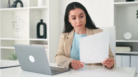 Work with documents. Focused serious indian or arabian business woman, financial Vídeos de archivo 266953347