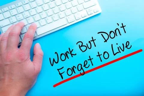 Work But Don't Forget to Live  Sign Working at home with computer man writing Stock-Fotos