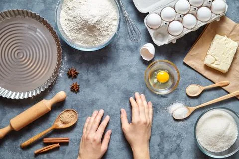 Work with the dough. The kitchen table raw ingredients, the woman's hand ready Stock Photos