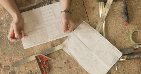 Work with drawings on a workbench Stock Footage 74714659