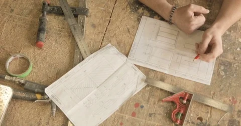 Work with drawings on a workbench Stock Footage 74714925