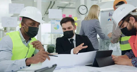 Work during coronavirus pandemia where good-looking confident hardworking Stock Footage 145800622