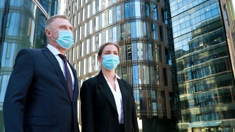 Work during self-isolation and quarantine. Young woman employee and her boss in Stock Footage 134599411