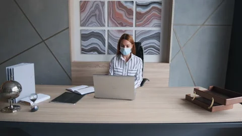 Work during self-isolation and quarantine. Young woman employee in a medical Video stock 137605368