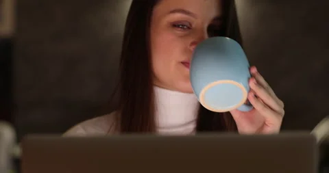 Work during self-isolation and quarantine. Young woman employee works at home at Stock Footage 155172657