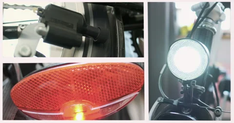 Work of a dynamo machine on bicycle. The front headlight and taillight are on 動画素材 197375913