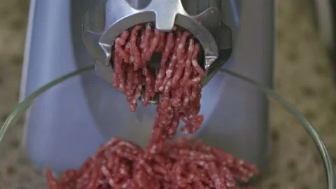 The work of an electric meat grinder close-up. Cooking minced meat from meat. Stock Footage 166560901