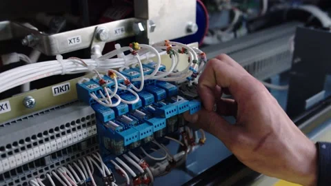 The work of an electrician close-up, an electrician of low-current equipment Stock Footage 196358190