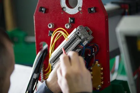 Work of electrician engineer - switching and testing equipment with wires 스톡 사진