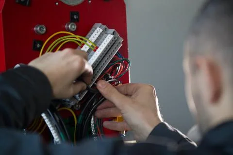 Work of electrician engineer - switching and testing equipment with wires Fotos de archivo