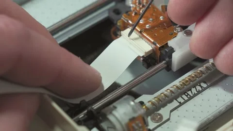 The work of an electronics repairman. Detach the loop cable from the digital  Stock Footage 190361683