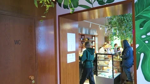 The work of the employees of the coffee shop. Cake stand and cashier Stock Footage 224937553