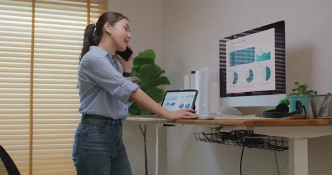 Work ergonomic electric standing desk benefit in modern workstation. Stock Footage 174510894