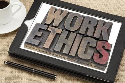  work ethics on digital tablet work ethics in vintage letterpress wood typ... Stock-Fotos