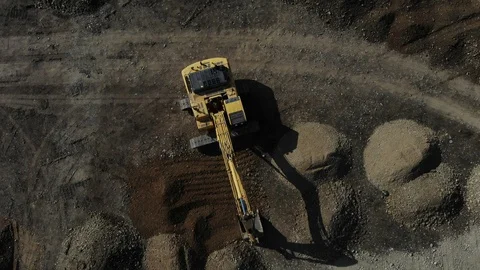 The work of the excavator. Digger from the air. Aerial view of the excavator. Stock Footage 125536620