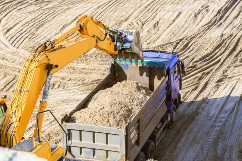 Work of the excavator at quarry. Loading sand. Stock Photos