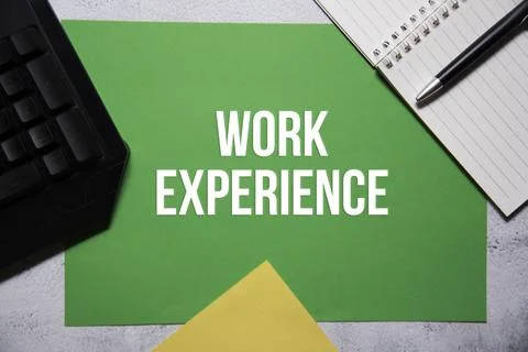 Work experience text on green and yellow background flat lay concept. Stock Photos
