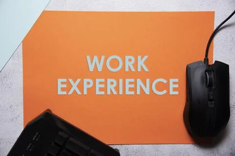 Work experience text on orange and baby blue background flat lay concept. Stock Photos