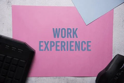 Work experience text on pink and blue background flat lay concept. Stock Photos