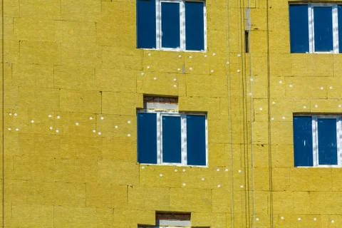 Work on the external walls of glass wool insulation and plaster Stock Photos