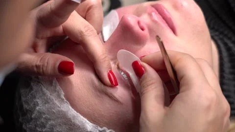 Work eyelash extension master. Lash Maker prepares client eyelashes. Stock Footage 148475204