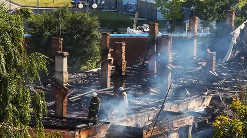 Work firefighters at putting out the burning roof Stock Footage 80020276