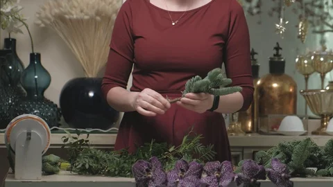 The work of the florist. Creating a flower bouquet Stock Footage 127612342