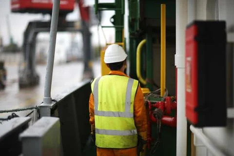 Work on the freighter near the control panel of lifting and handling equipmen Stock Photos