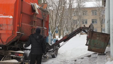 Work the garbage cars in winter. Garbage transport car loading itself. Stock Footage 88185431