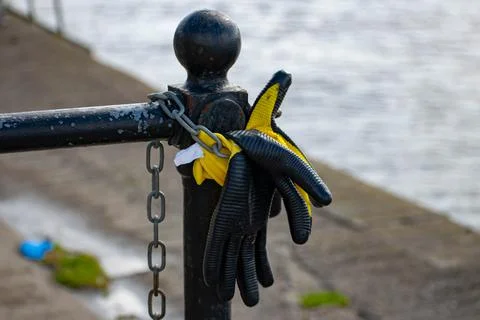 Work gloves left on a post	 Stock Photos