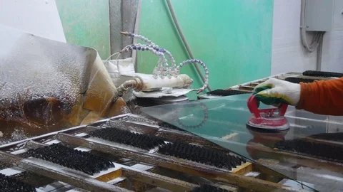 Work gloves makes the chamfer on the glass.Grinding float glass closeup. 스톡 동영상 122013424