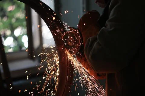 Work with a grinder, preparing the metal for welding 스톡 사진
